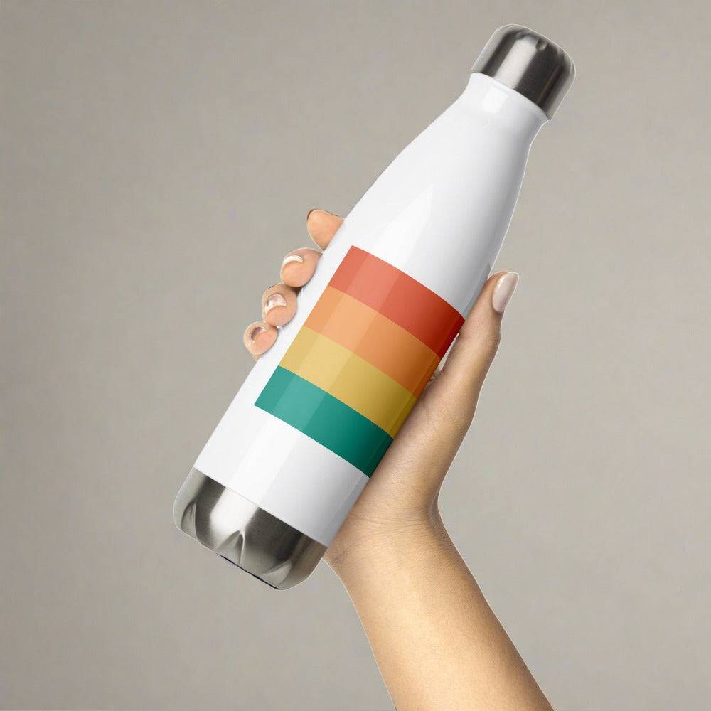 woman holding a steel water bottle with 4 colored stripes
