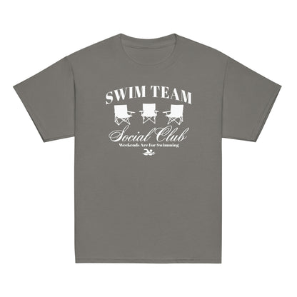 Charcoal gray Swim Team Social Club Youth T-shirt by TrendySwimmer with white foldable chair design and swim lifestyle message.