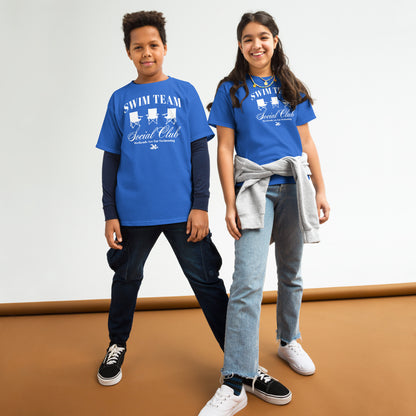 Two kids wearing royal blue Swim Team Social Club Youth T-shirts by TrendySwimmer, styled casually with jeans and sneakers.