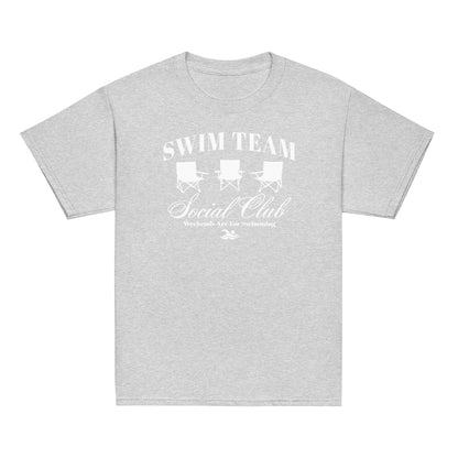 Heather gray Swim Team Social Club Youth T-shirt by TrendySwimmer with subtle white foldable chair graphic and swim-themed text.