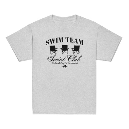 Swim Team Social Club Youth T-Shirt in classic light gray with black foldable chair graphic and swim-themed text. Soft cotton tee for young swimmers.